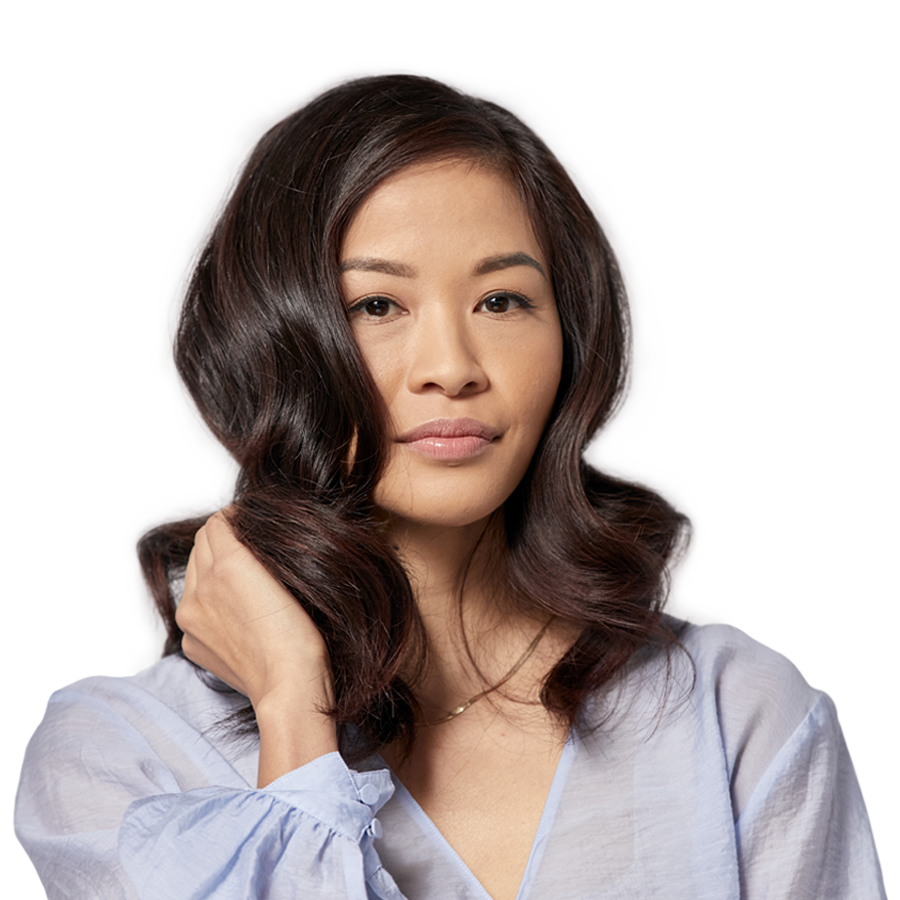 model with long wavy hair showing off her hair colour