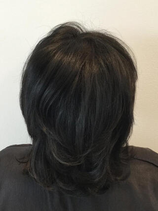 After photo: rear view of woman with short black hair with no grey after colour.